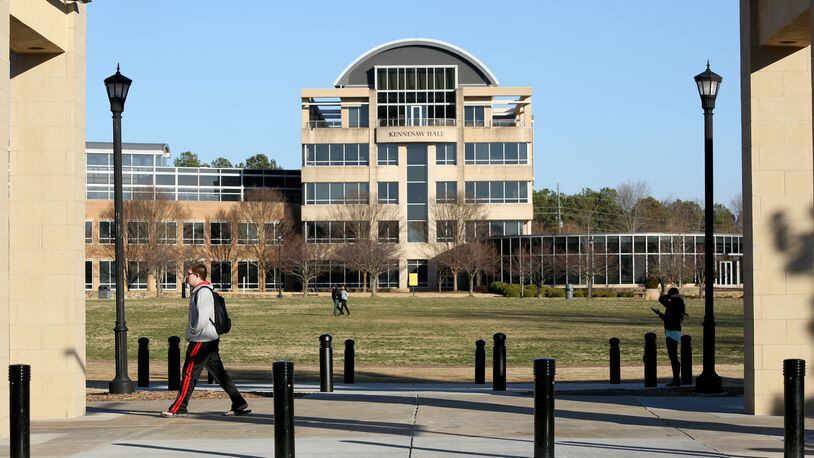 FILE PHOTO: Kennesaw State University students walk on the KSU campus as Kennesaw Hall is shown in the background /JASON GETZ
