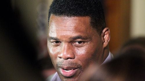 Herschel Walker speaks to journalists after filling out his paperwork to qualify to run for the U.S. Senate at the Georgia State Capitol on Monday, Mar. 7, 2022. Steve Schaefer for the Atlanta Journal-Constitution