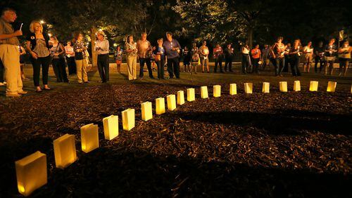 Metro area residents participate in a 2013 candlelight vigil sponsored by the Metro Atlanta Chapter of the American Foundation for Suicide Prevention in Piedmont Park. CURTIS COMPTON/CCOMPTON@AJC.COM
