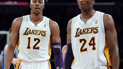 Dwight Howard (left) and Kobe Bryant of the Los Angeles Lakers leave the court during a game in 2012. (Photo by Harry How/Getty Images)