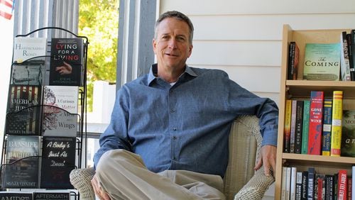 SFK Press co-founder Steve McCondichie is seated in his pop-up bookstore, Southern Fried Books, located on the front porch of his commercial real estate business in Newnan. The store, which he says will operate through Christmas, sells SFK books as well as other Southern titles. CONTRIBUTED