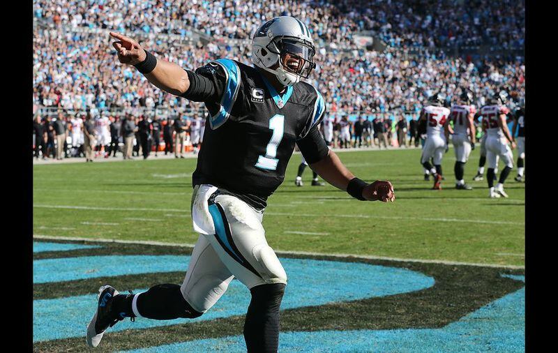 CHARLOTTE: Panthers quarterback Cam Newton celebrates a score for a 21-0 lead over the Falcons during the first quarter in a football game on Sunday, Dec. 13, 2015, in Charlotte. Curtis Compton / ccompton@ajc.com