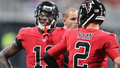 Atlanta Falcons wide receiver Julio Jones and quarterback Matt Ryan confer during the second half against the Saints Thursday, Dec. 7, 2017, in Atlanta.