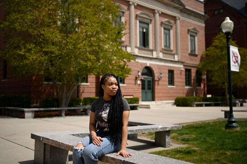 Ashnaelle Bijoux poses on campus, Saturday, April 27, 2024, at Norwich Free Academy in Norwich, Conn. Bijoux, a senior at NFA, has been unable to complete the FAFSA form due to a glitch with the form. Without the form and the financial aid it brings, Bijoux won't be able to pursue her goal of going to Southern Connecticut State University to become a therapist. (AP Photo/Jessica Hill)