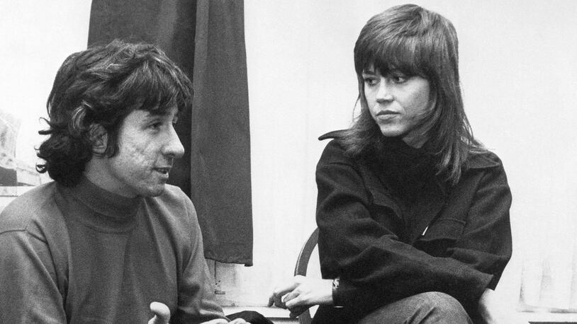 FILE - In this Dec. 26, 1972 file photo, actress Jane Fonda, right, and Tom Hayden, one of the founders of SDS, talk at the home of a friend in London, after their arrival from Paris. Hayden, the famed 1960s anti-war activist who moved beyond his notoriety as a Chicago 8 defendant to become a California legislator, author and lecturer, has died at age 76. His wife, Barbara Williams, says Hayden died on Sunday, Oct. 23, 2016, in Santa Monica of a long illness. (AP Photo, File)