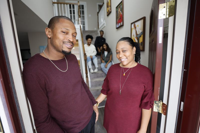 Eric and Oriana Wyche, seen last month at their Jonesboro home, had to compete with investors in their search. Oriana said with every rejected bid, she got a similar answer. "A lot of them told me it went to an investor who could close sooner, who could put more money down," she said. "You just couldn't compete." (Miguel Martinez / miguel.martinezjimenez@ajc.com)