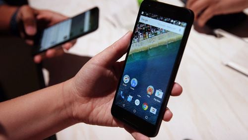 SAN FRANCISCO, CA - SEPTEMBER 29: An attendee inspects the new Nexus 5X phone during a Google media event on September 29, 2015 in San Francisco, California. Google unveiled its 2015 smartphone lineup, the Nexus 5x and Nexus 6P, the new Chromecast and new Android 6.0 Marshmallow software features. (Photo by Justin Sullivan/Getty Images)