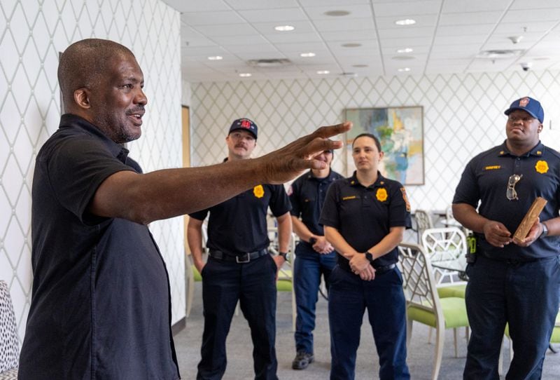Atlanta Fire Rescue Department Lieutenant Mark Quick, who made a living saving lives, talked with DeKalb County Fire Rescue members at The Shepherd Center who helped save is life. 
 PHIL SKINNER FOR THE ATLANTA JOURNAL-CONSTITUTION