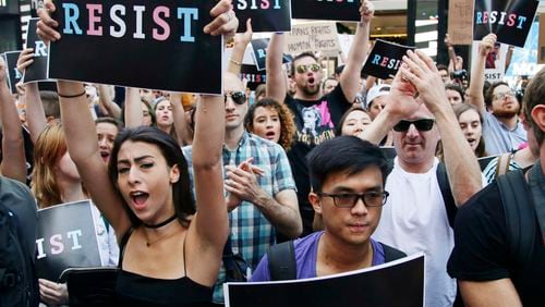 July 26, 2017: Protesters rally in New York City to protest President Donald Trump’s announcement of a ban on transgender troops serving anywhere in the U.S. military. (AP Photo/Frank Franklin II, File)