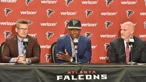 April 29, 2016 Flowery Branch - Falcons first-round pick Keanu Neal speaks as Falcons general manager Thomas Dimitroff (left) and coach Dan Quinn sit next him during a press conference at the Falcons' Flowery Branch Headquarters Complex on Friday, April 29, 2016. With the 17th pick in the 2016 NFL Draft, the Falcons selected defensive back Keanu Neal of Florida. HYOSUB SHIN / HSHIN@AJC.COM