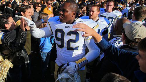 ATLANTA, GA - NOVEMBER 15: Francis Kallon #92 of the Georgia Tech Yellow Jackets celebrates with fans on the field after beating the Clemson Tigers at Bobby Dodd Stadium on November 15, 2014 in Atlanta, Georgia. Georgia Tech won 28-6. (Photo by Daniel Shirey/Getty Images) To coach Paul Johnson, defensive tackle Francis Kallon is a key to the play of the defensive line. (GETTY IMAGES)