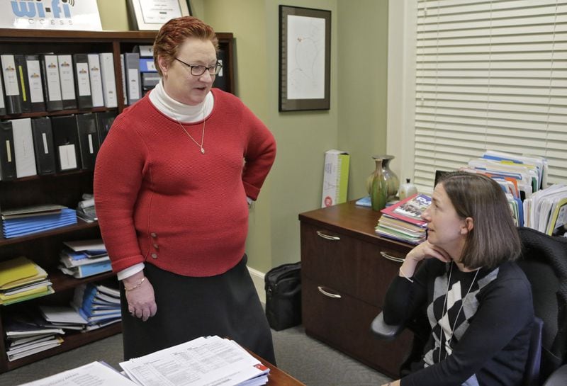 Peggy Merriss (left), speaks with assistant city manager Andrea Arnold. Decatur’s city manager for 24 years, Merriss said, “When you look at cities that are successful, there has to be a unified vision, not only among the staff, but among the elective leadership.” BOB ANDRES /BANDRES@AJC.COM