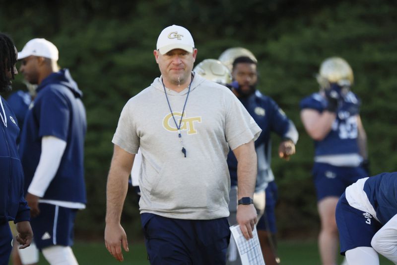 Georgia Tech coach Brent Key keeps an eye on the action as the Yellow Jackets opened spring football practice Monday.