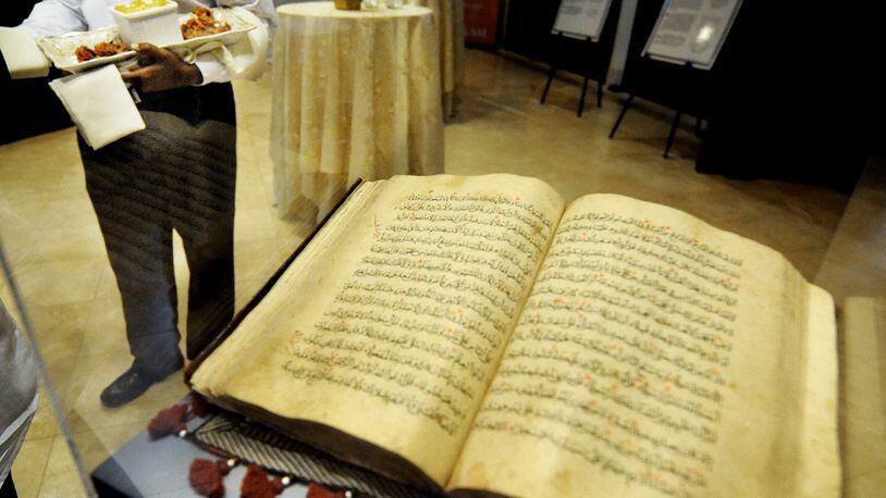 The Al-Farooq Masjid  during an open house. .A 500 year-old Quran was on display in the lobby as hors d’oeuvres are served.  STAFF PHOTO