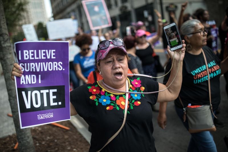 "I believe survivors. And I vote" said this protester's sign at a demonstration Saturday, Oct. 8, 2018, in Atlanta before the expected confirmation of U.S. Supreme Court nominee Brett Kavanaugh. (Photo: BRANDEN CAMP/Contributed)
