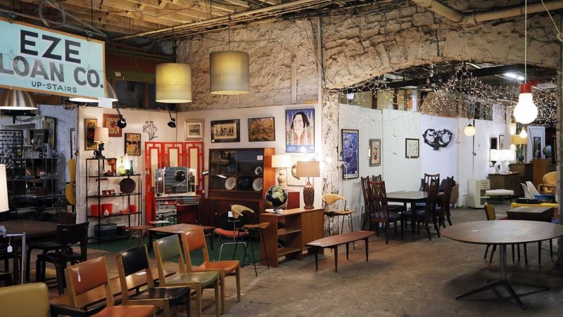 This is the cavernous basement of Atlanta’s Highland Row Antiques, which specializes in midcentury modern pieces, including furniture, art and lighting fixtures and odd funky pieces. BOB ANDRES / BANDRES@AJC.COM