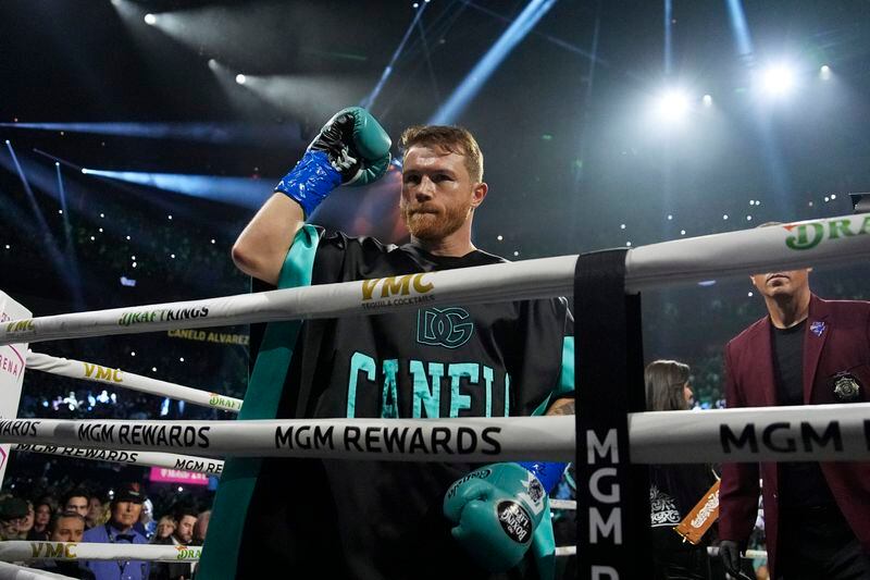Canelo Alvarez motions from the ring before fighting Jaime Munguia in a super middleweight title fight Saturday, May 4, 2024, in Las Vegas. (AP Photo/John Locher)