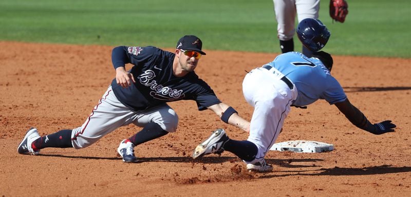 Braves second baseman Sean Kazmar tags Tampa Bay Rays infielder Vidal Brujan out on a steal attempt Sunday, Feb. 28, 2021, at Charlotte Sports Park in Port Charlotte, Fla. (Curtis Compton / Curtis.Compton@ajc.com)