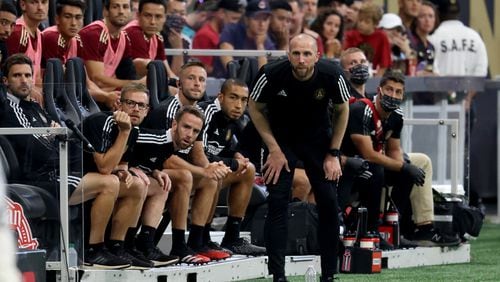 Atlanta United interim manager Rob Valentino watches from the bench during the first half against the Columbus Crew Saturday, July 24, 2021, at Mercedes Benz Stadium in Atlanta. (Jason Getz/For the AJC)