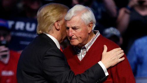 Republican presidential candidate Donald Trump greets former Indiana basketball coach Bob Knight during an April 27 campaign stop in Indianapolis. (AP Photo/Darron Cummings)