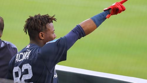 March 27, 2018 Atlanta: Braves outfielder Ronald Acuna Jr., points at the opposing dugout during the first inning in the Future Stars Exhibition Game on Tuesday, March 27, 2018, at SunTrust Park in Atlanta.  Curtis Compton/ccompton@ajc.com