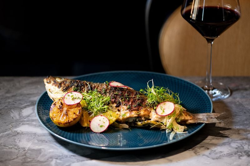 Grilled Whole Branzino with soft herbs and fennel-citrus salad. Photo credit- Mia Yakel.