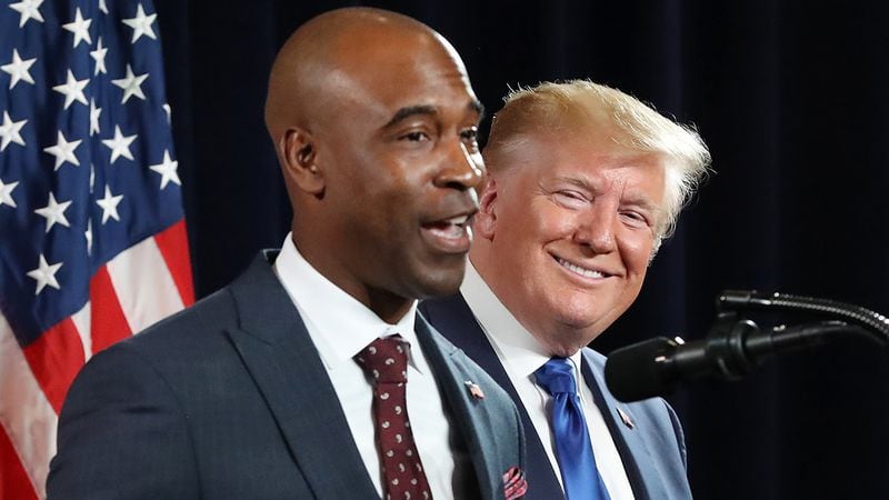 Republican Kelvin King (left) to challenge Warnock in the 2022 Senate contest. Then, President Donald Trump looks on, while King joins him on stage to speak during the Black Voices for Trump Coalition Rollout on Friday, November 8, 2019, in Atlanta.  (Curtis Compton/Atlanta Journal-Constitution/TNS)