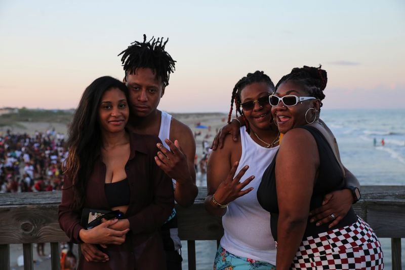 Alicia Lawrence and her friends pose for a photo while hanging out on the Tybee Island Peir during Orange Crush on Saturday, April 22.