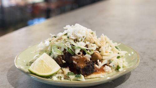 Babalu gets it right when it comes to dressing the pork belly taco, a fatty, rich, tender concoction. CONTRIBUTED BY HENRI HOLLIS
