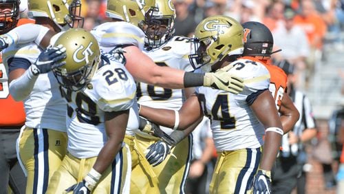 September 10, 2016 Atlanta - Georgia Tech Yellow Jackets running back Marcus Allen (24) is celebrated by teammates after he scored a touchdown in the first half at Bobby Dodd Stadium on Saturday, September 10, 2016. HYOSUB SHIN / HSHIN@AJC.COM