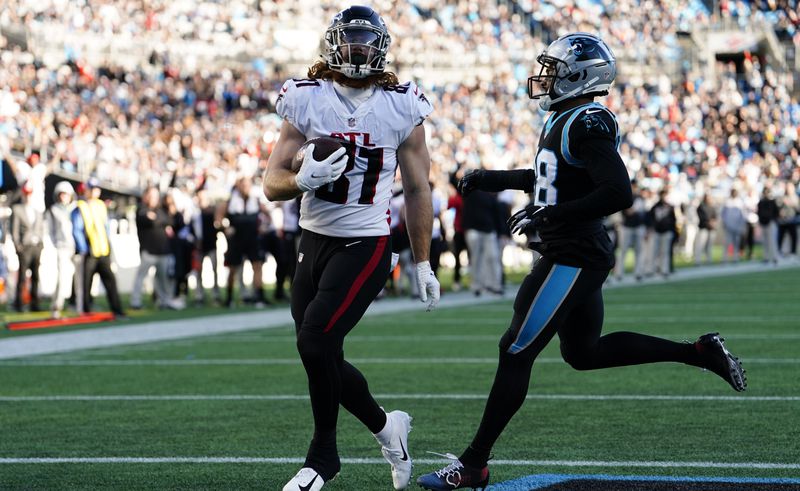 Falcons tight end Hayden Hurst scores on a pass from Matt Ryan during the second half of Sunday's game against the Panthers in Charlotte.