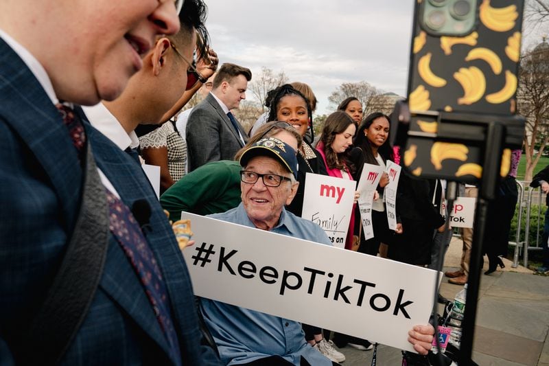 Kenny Jarry holds a sign before a news conference during a lobbying trip sponsored by the app in advance of the congressional hearings, in Washington, March 22, 2023. (Shuran Huang/The New York Times)
