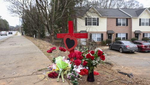 A memorial is set up for University of Georgia football player Devin Willock and UGA football team staff member Chandler LeCroy at the site where their vehicle crashed on Barnett Shoals Rd, Saturday, Jan. 21, 2023, in Athens, Ga.. Willock and LeCroy died from their injures caused from the Sunday morning accident, Jan. 15, 2023. Two other passengers were injured. Jason Getz / Jason.Getz@ajc.com)

