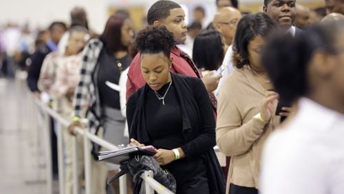 People lined up for more than 500 jobs offered at a recent Airport Community Job Fair. BOB ANDRES /BANDRES@AJC.COM