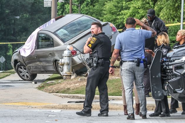 A woman was shot and killed while driving Friday morning. It happened just outside the parking lot of a Walmart near the Mall at Stonecrest in DeKalb County.