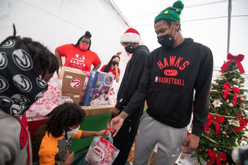 Cam Reddish made a surprise appearance at the party to hand out gifts.