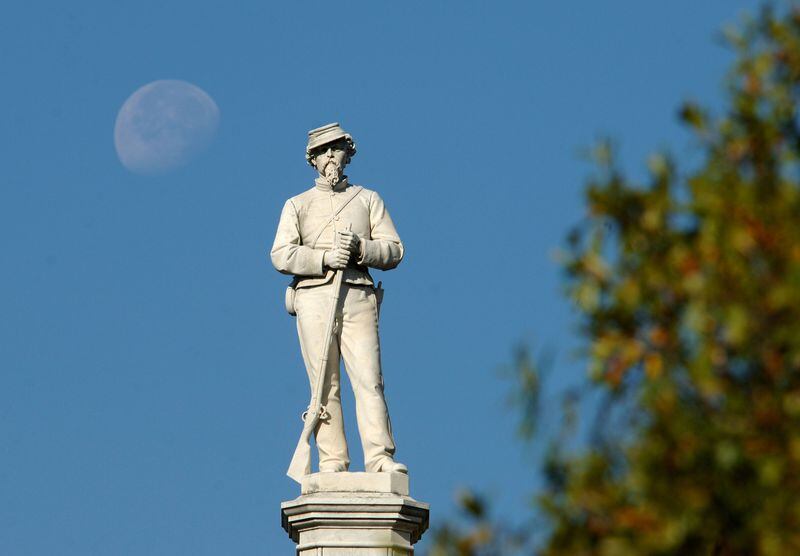 The waning moon is seen behind the Confederate Monument on Broad Street in downtown Augusta in 2009. Sean Moores/Augusta Chronicle