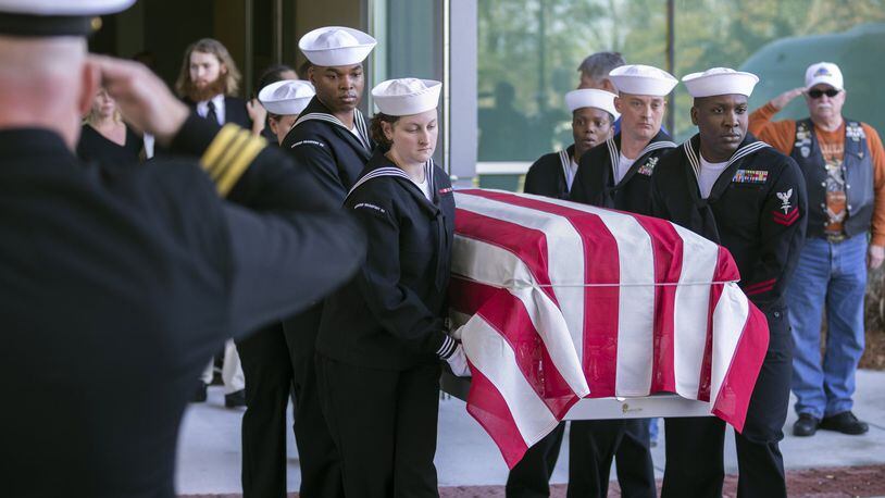 Navy personnel carry the casket of Cameron Walters, 21, of Richmond Hill, after his funeral service in Savannah in December. Walters was one of the three sailors killed in the Dec. 6 shooting at Naval Air Station Pensacola. (AJC Photo/Stephen B. Morton)