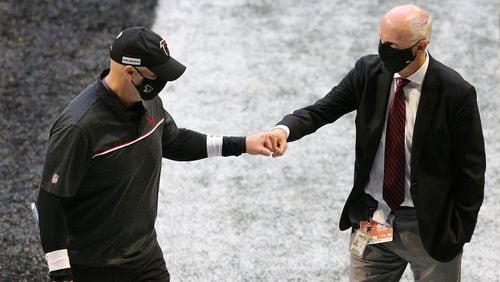 Falcons President and CEO Rich McKay (right) with coach Dan Quinn after the 2020 season opener vs, Seattle.
