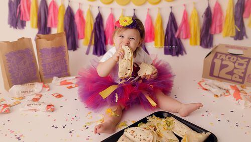 Monica Phillips, of St. Louis, Mo., chose a Taco Bell-themed photo shoot for her daughter’s first birthday. Little Delta Rose chewed up the scenery, literally, as she tore into some soft tacos.