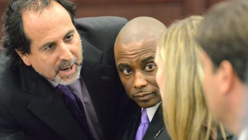 Clayton County Sheriff Victor (second from left) confers with his defense attorneys (from left) Drew Findling, Marissa Goldberg, and Steven Frey before the announcement of the verdict at Clayton County Superior Court on Aug. 15, 2013. Victor Hill was cleared on all counts in his racketeering trial.