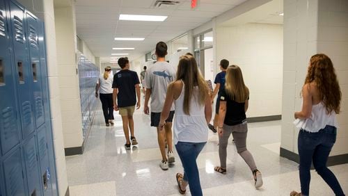 08/01/2018 -- Kennesaw, Georgia -- Students tour the hallway during the first day of school at Carl Harrison High School in Kennesaw, Wednesday, August 1, 2018.  (ALYSSA POINTER/ALYSSA.POINTER@AJC.COM)