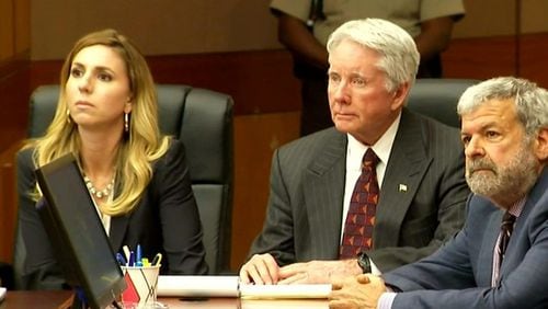 Tex McIver, flanked by his lawyers, will return to Fulton County Superior Court Judge Robert C.I. McBurney's courtroom Dec. 4 for the start of his murder retrial.