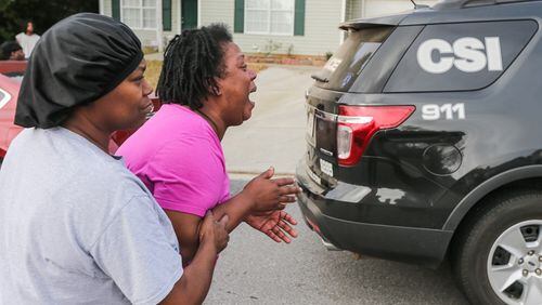 Teletha Walker grieves the death of her son, an 11th-grader at Charles Drew High School in Clayton County.