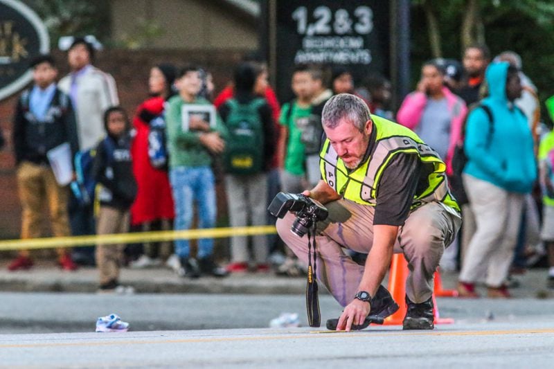DeKalb County authorities took photos of the scene where a 4-year-old girl was killed in a hit-and-run.