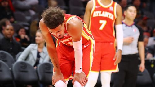 Hawks guards Trae Young (left) and Timothe Luwawu-Cabarrot react in the final minute of a 132-126 loss to the Houston Rockets who came from behind in the fourth period in a NBA basketball game on Monday, Dec 13, 2021, in Atlanta.   Curtis Compton / Curtis.Compton@ajc.com`