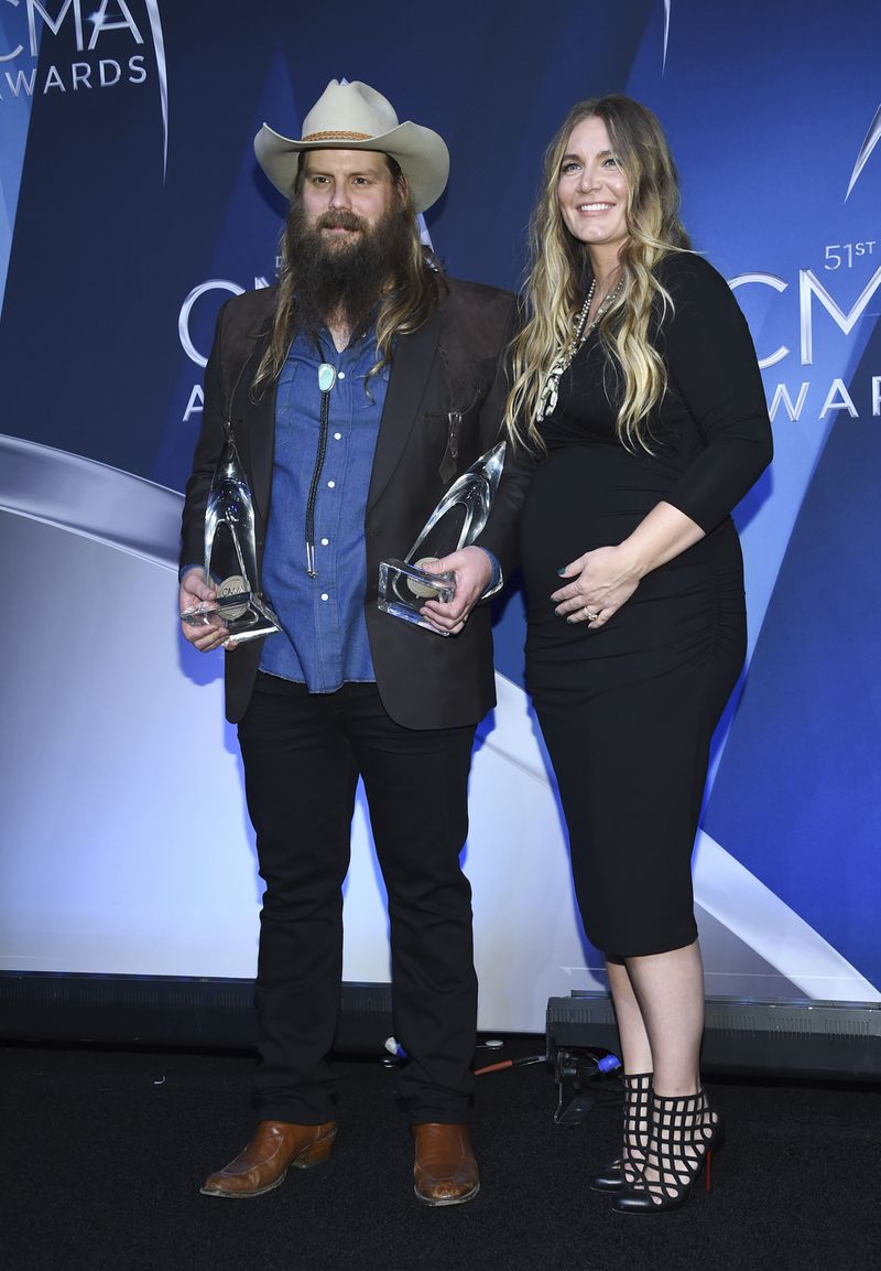  Musician Chris Stapleton and his wife Morgane Stapleton  in the press room with the awards for album of the year and male vocalist of the year. (Photo by Evan Agostini/Invision/AP)