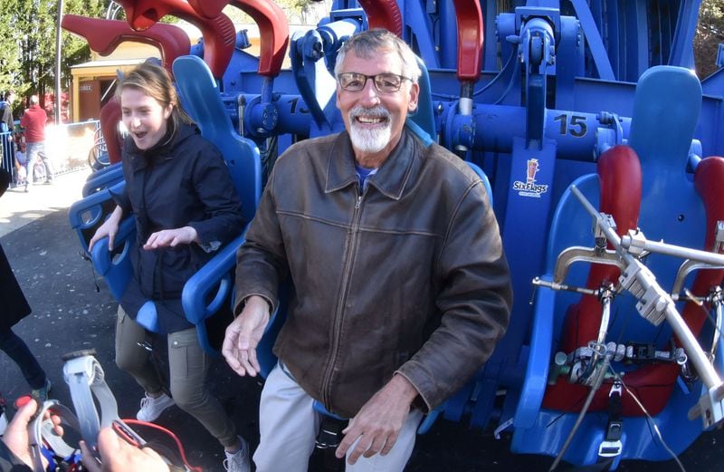 The AJC’s Tom Kelley (right) and Emily Thomas react after they rode Drop of Doom VR, a new virtual reality version of the Acrophobia drop tower, at Six Flags Over Georgia. Using Samsung Gear VR powered by Oculus, riders become the pilots of a futuristic gunship under attack by mutant spiders. Drop of Doom VR debuts Saturday, March 11, when Six Flags Over Georgia opens for the season. HYOSUB SHIN / HSHIN@AJC.COM