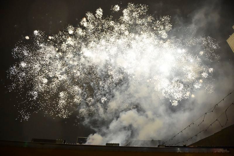January 1, 2017, Atlanta - Fireworks are shot off at midnight at the Peach Drop in Atlanta, Georgia, on Sunday, January 1, 2017. (DAVID BARNES / DAVID.BARNES@AJC.COM)