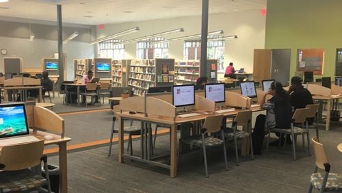 Lilburn’s new library offers customers 36 computer workstations, half are Macs, half are PCs. Photo: Karen Huppertz for the AJC